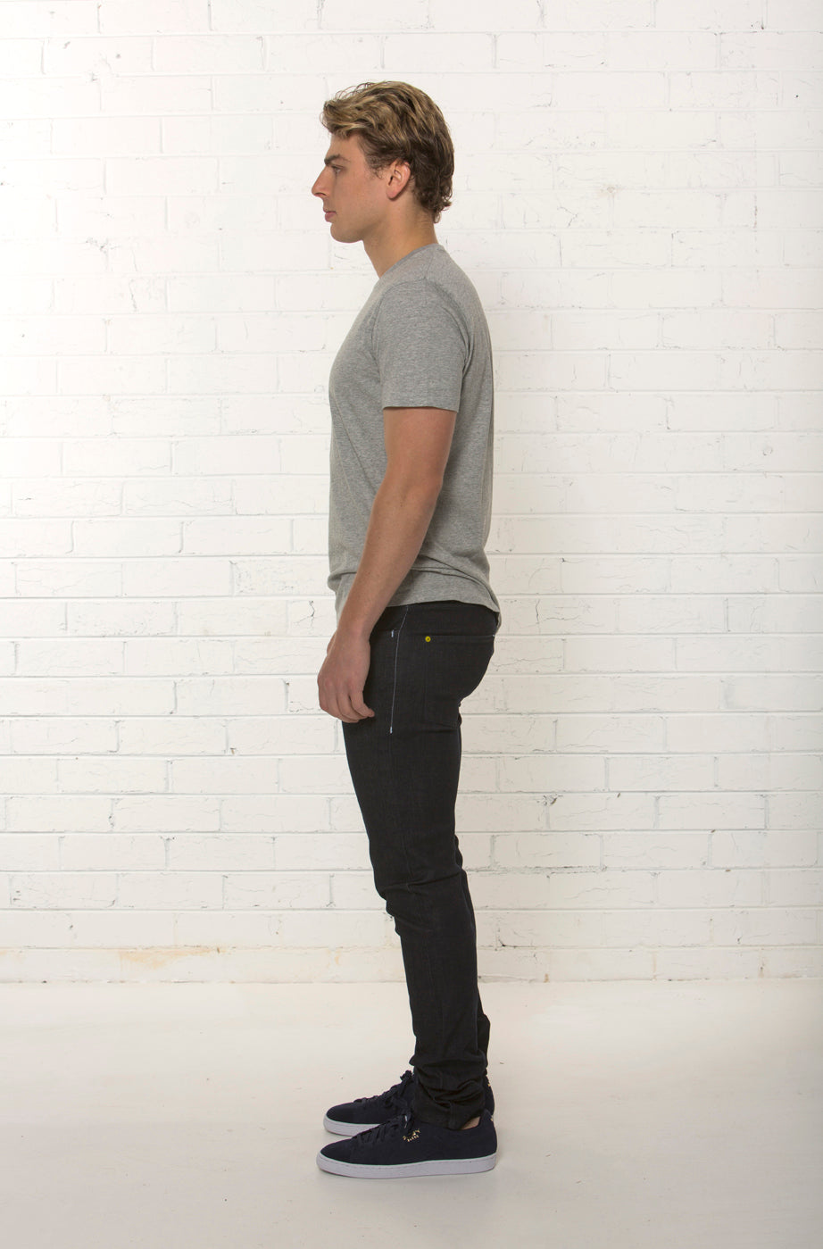 Side profile of dark blue organic denim jean by TRi COLOUR FEDERATiON