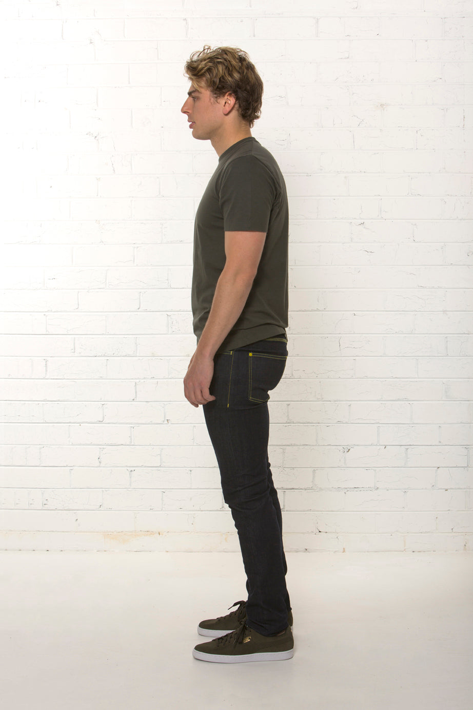Side view of men's organic dark blue jean, mid rise fit by TRi COLOUR FEDERATiON