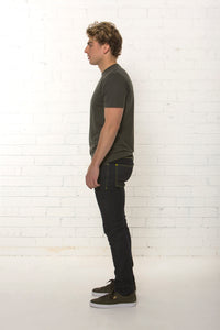Side view of men's organic dark blue jean, mid rise fit by TRi COLOUR FEDERATiON